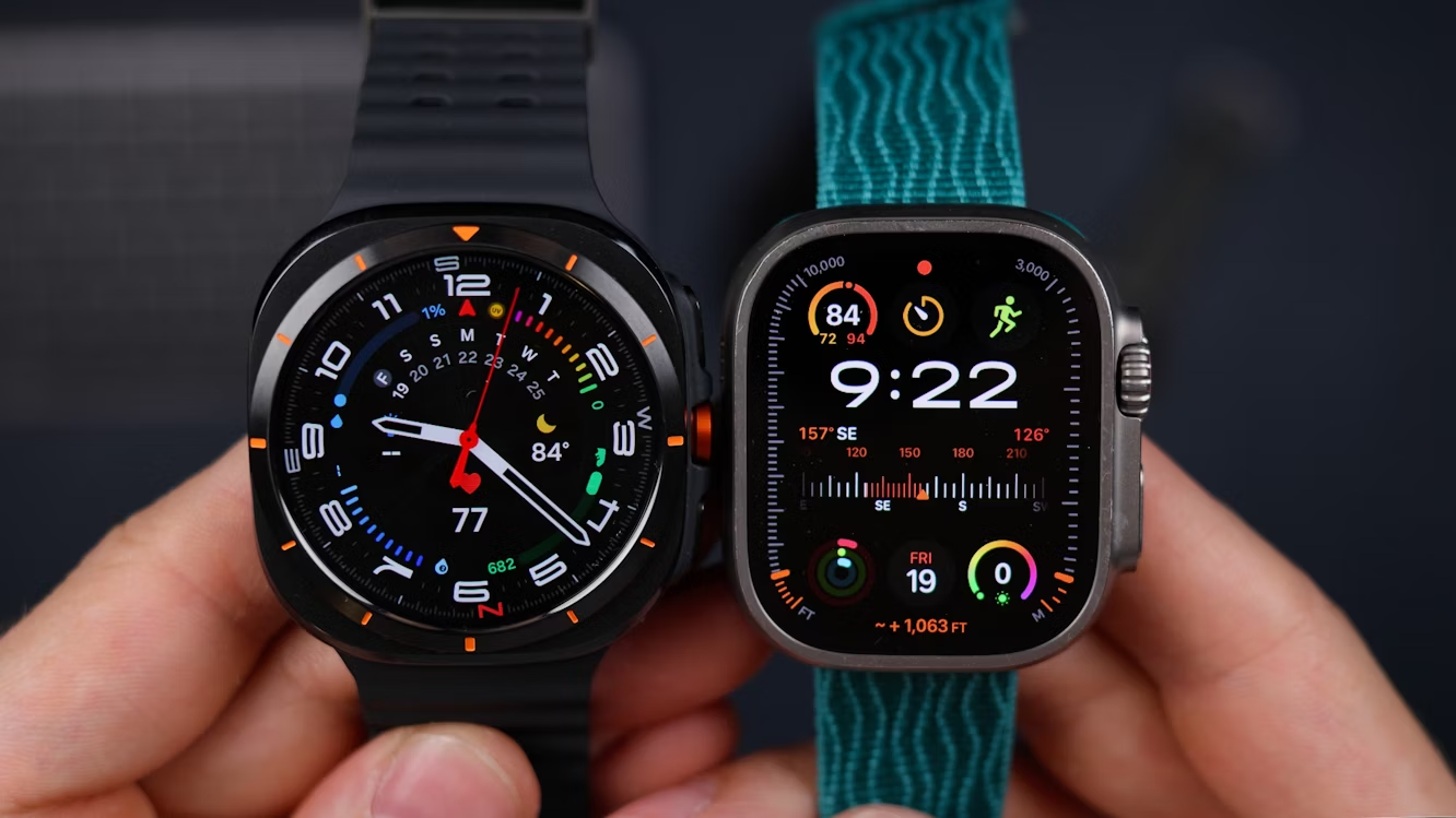 Close-up of two smartwatches side by side showing fitness tracking and digital time displays